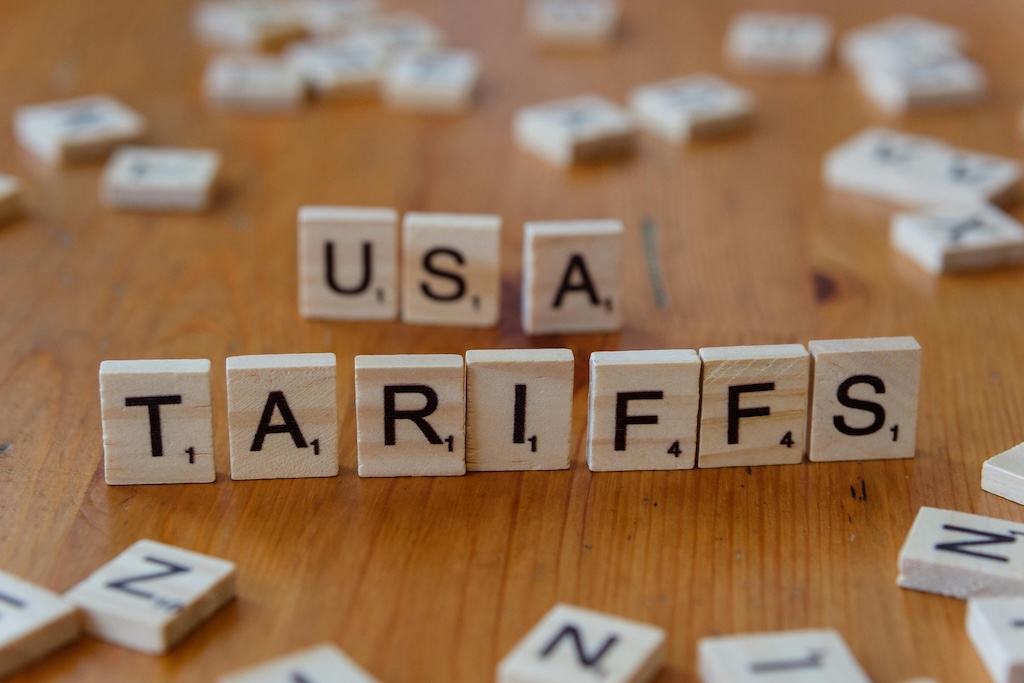 Calculator showing tariff rates and landed cost increases for international brands entering U.S. market